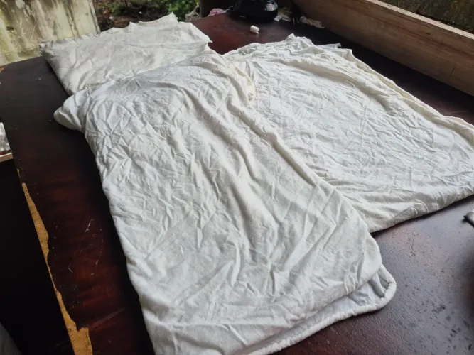 Pano para limpeza e estopa costuradas.