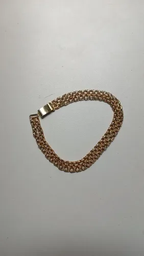 Pulseira de prata banhada a ouro.