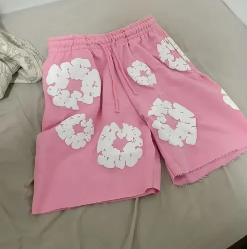 Bermuda masculina rosa de moletom - denim tears
