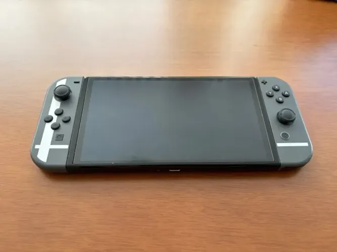 Nintendo Switch OLED Edição Smash Bros + Case