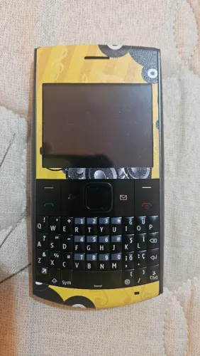 Skin Adesiva para Nokia X2-01 - Estilo Musical Vibrante!