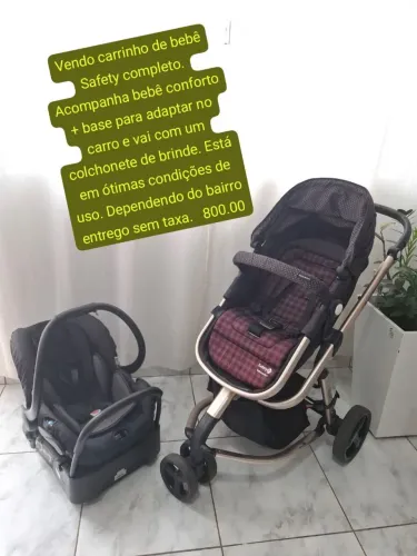 Carrinho de bebê com bebê conforto 