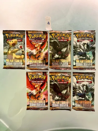 LOTE 04/05 - Pokémon HeartGold & SoulSilver - 7 Boosters Originais, Lacrados (Arthur Alem)