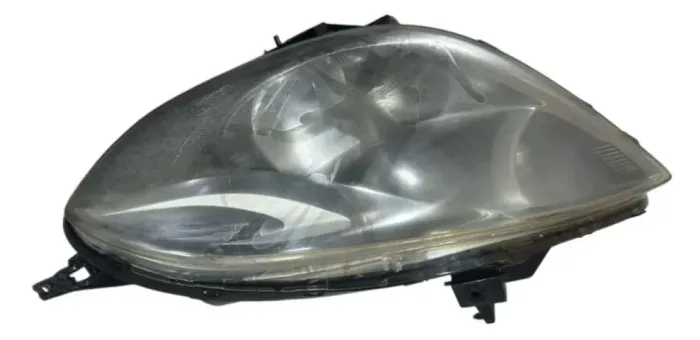 farol dianteiro esquerdo NISSAN VERSA 1.6 2008-2013 *90 ORI