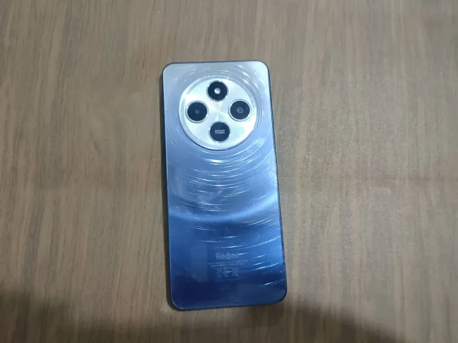 CELULAR REDMI 14C SEMI USADO ÚNICO DONO VEM COM CAIXA , CARREGADOR PELÍCULA