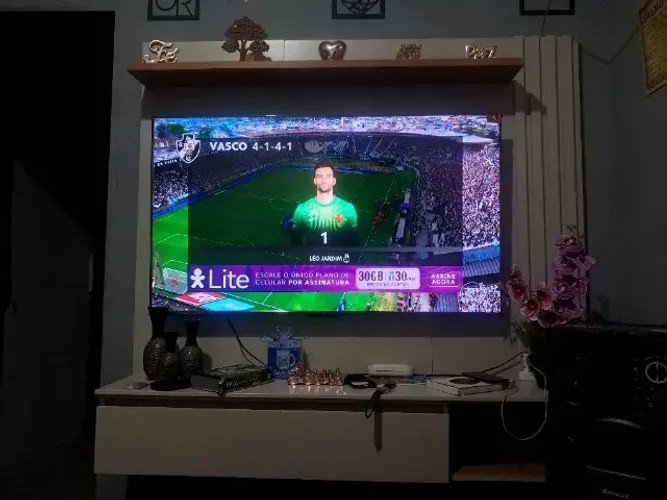 Rack painel + televisão tcl 55 polegadas nova