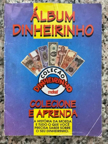 Álbum de figurinhas colecionável chamado Dinheirinho, da marca Mabel, lançado nos anos 90