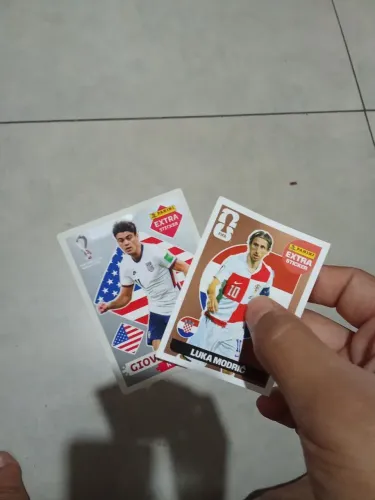 Figurinhas da copa de 22 e de 26.
