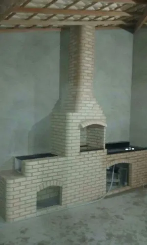 Churrasqueira fogão a lenha e pia de granito