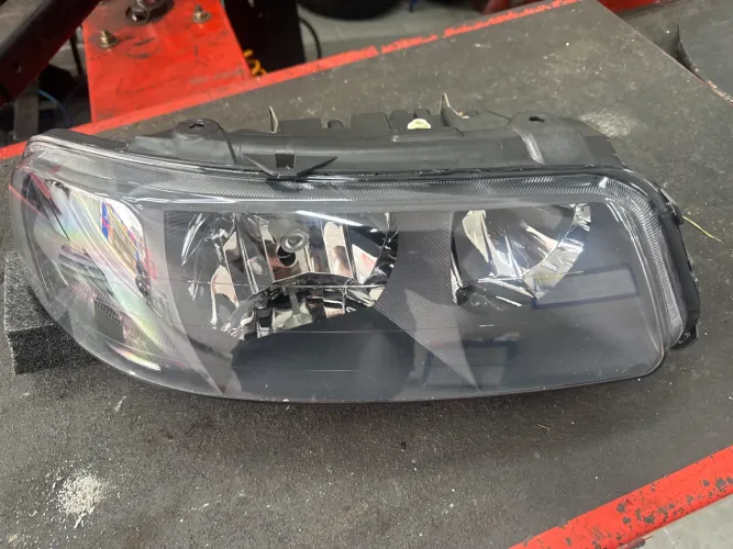 Farol Diant Dir Dourado Orig Vw Série Fun Gol Parati Sav G3