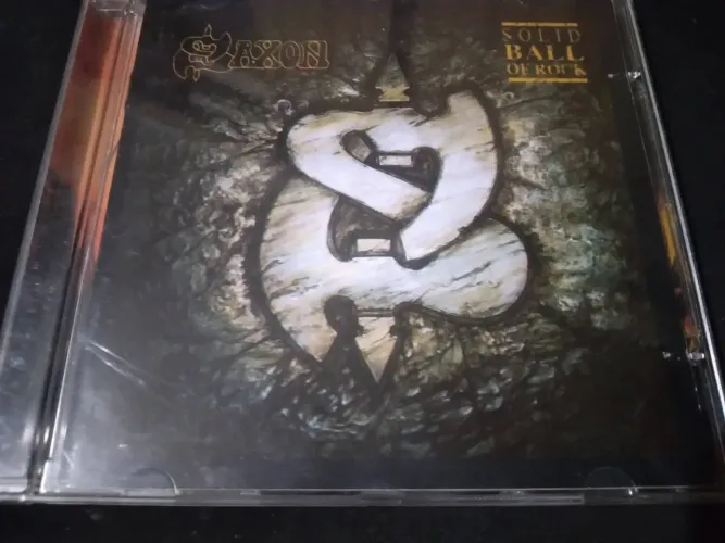 Cd Saxon - Solid Ball Of Rock