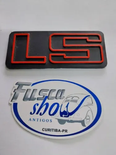 Emblema LS Vermelho Grade Gol Voyage Passat