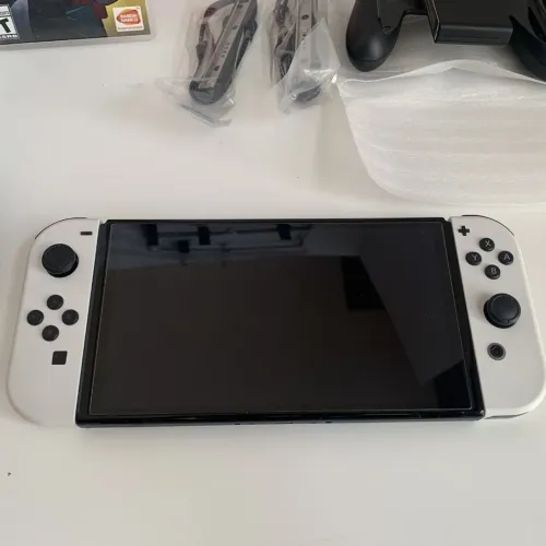 Nintendo switch oled + conta com vários jogos