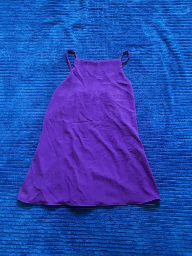 Macacão roxo. Tamanho G