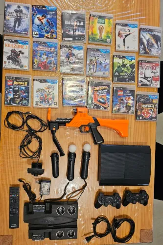 PS3 com jogos, câmera e acessórios