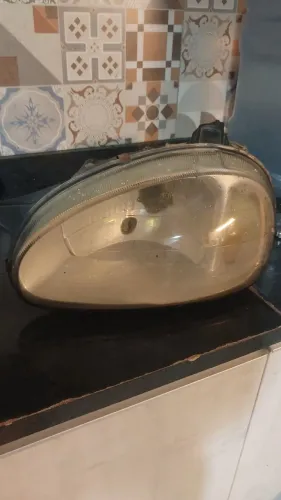 Farol corsa classic lado motorista/esquerdo