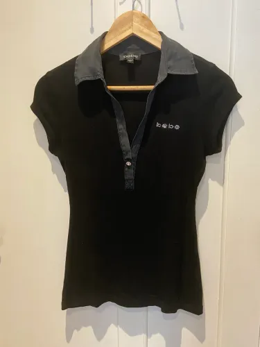Bebe preta blusa G mas serve até M