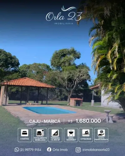 CAJU, IMOBILIÁRIA 23 VENDE! Casa espetacular no bairro Caju com amplo terreno em Maricá