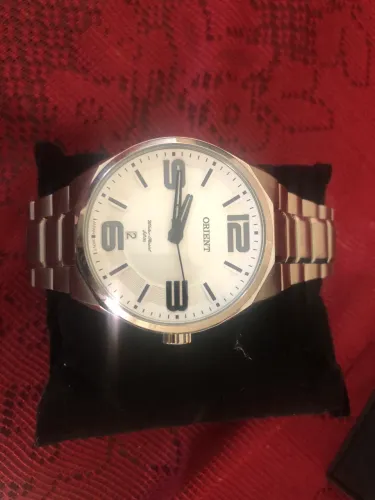 Relógio oriente novo na caixa