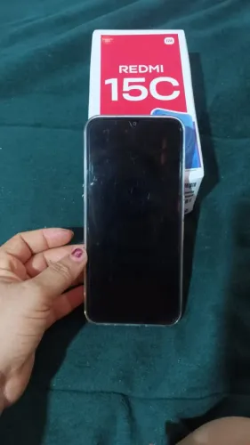 Redmi 15C novo. Novo na caixa, as manchas na tela são de usa, está com película que veio