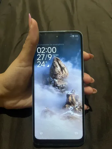 Redmi 12 128GB usado, funcionando perfeitamente, com rachaduras na traseira