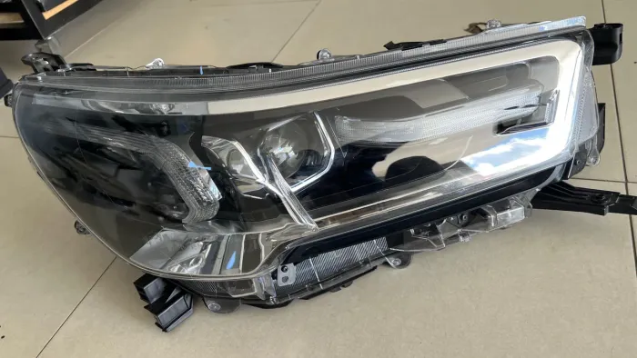 Par de Farol original Hilux Srx