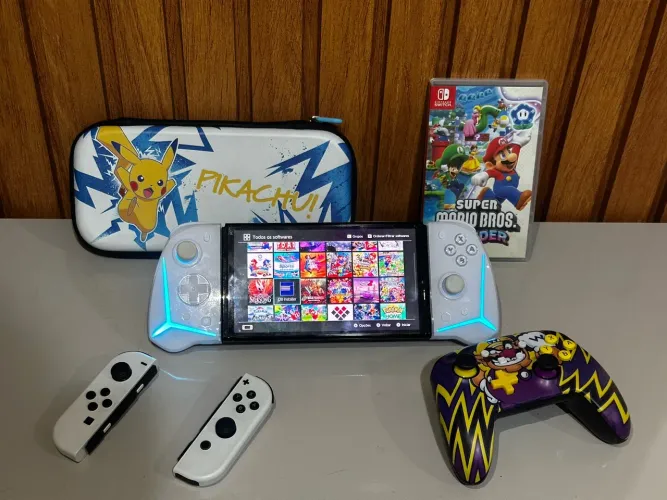 Nintendo switch OLED DESBLOQUEADO em estado de novo, com controles e sd card de 128gb