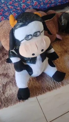 Urso vaquinha motoqueira , faz som ( tem que trocar a pilha)