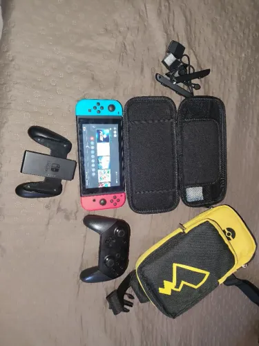 Nintendo switch com controle Extra e outros itens