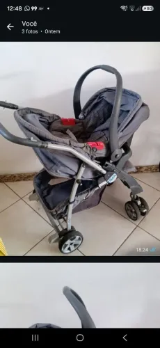 Carrinho bebê com bebê e conforto.