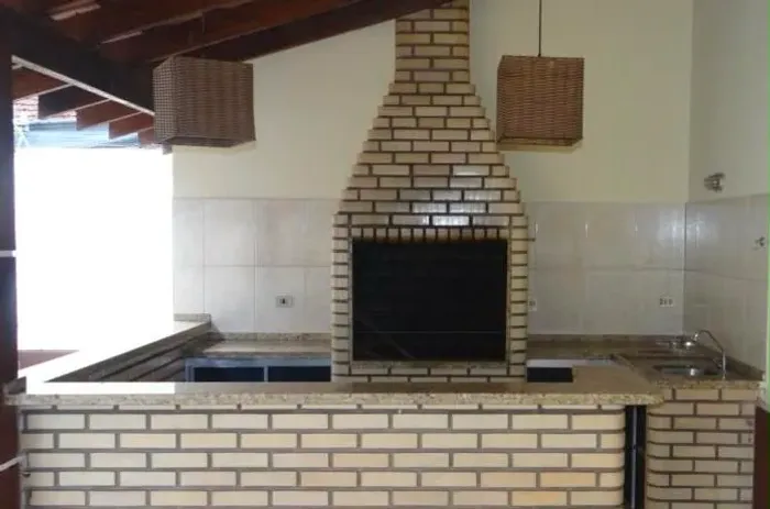 BANCADAS de área de churrasqueira com pia em inox GRANITO na cor Ornamental