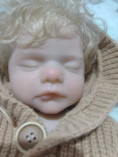 Bebê reborn de silicone sólido com cabelo implantado fio a fio
