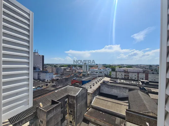 Apartamento central com elevador 3 dormitórios, suíte e vaga de garagem