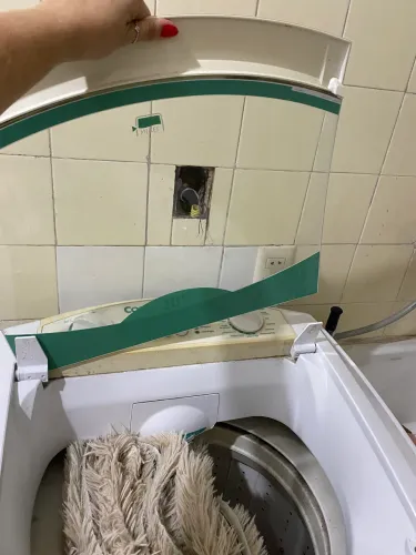 Máquina de lavar com defeito
