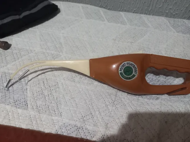 Carretilha e molinete de pesca de 1970. *