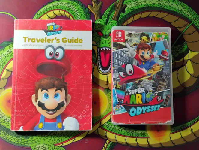 Jogo super Mario odyssey com o guia Traveler's Guide
