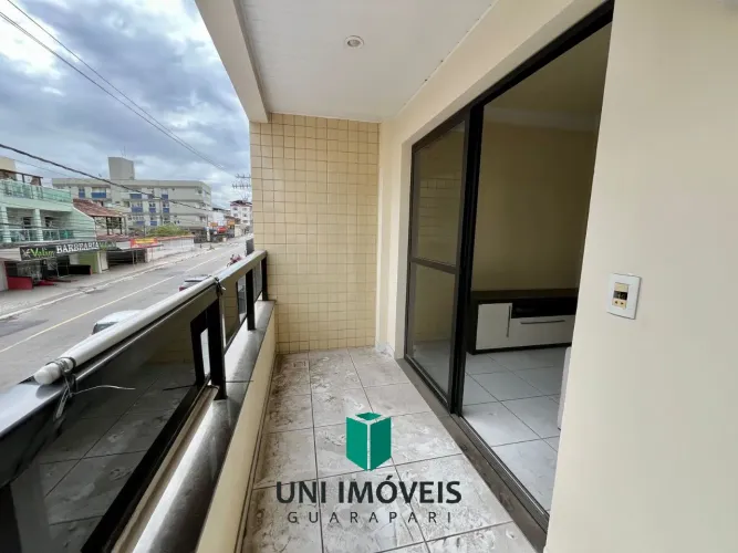 Oportunidade na Praia do Morro: 2 quartos (1 suíte), varanda de frente e elevador