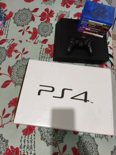 Ps4 pro na caixa com vários jogos