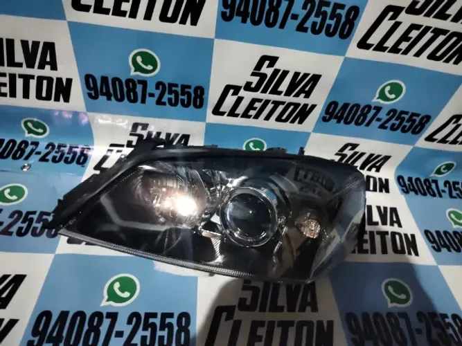 farol mascara negra esquerdo astra 2003 ate 2011 novo importado *