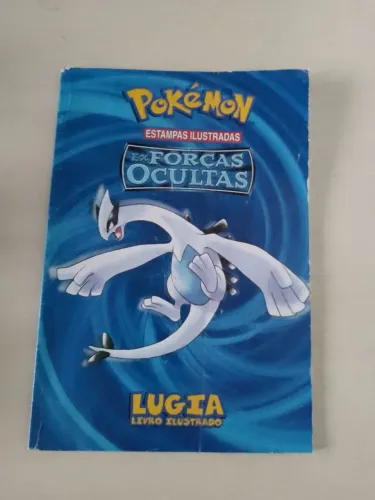 Livro ilustrado Pokémon Lugia Ex forças ocultas.