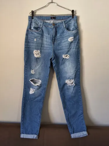 Jeans skinny destroyed cintura alta