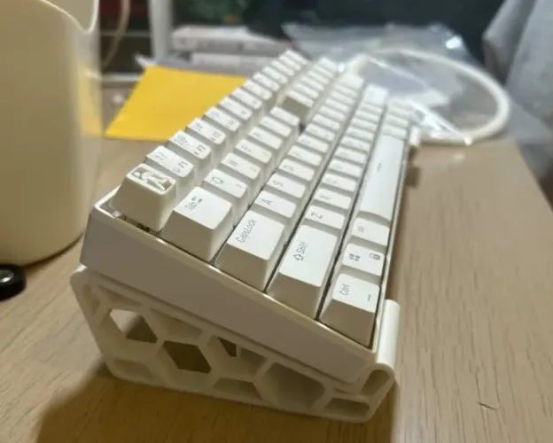 Suporte de teclado em colmeia