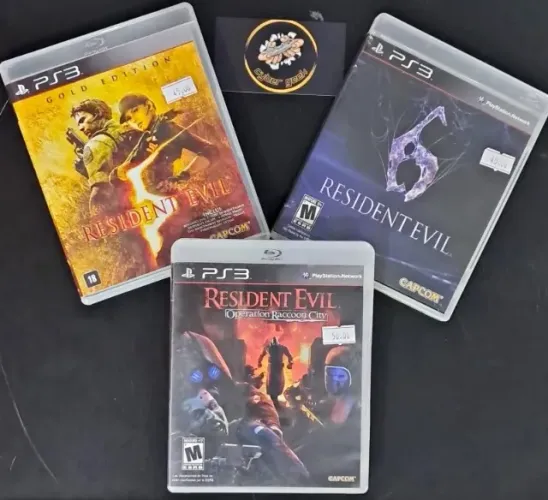 JOGOS PS 3 RESIDENT EVIL 5 , 6 , E OPERATION RACCOON CITY SEMINOVO