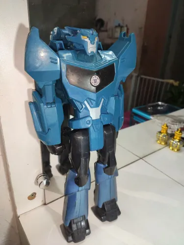 Boneco Steeljaw Transformers Titan Hero