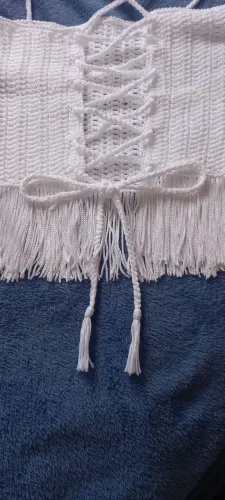 Blusa com franjas.