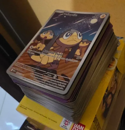 Bulk cerca de 100 cartas pokemon em português 