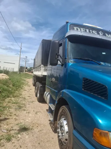 Conjunto volvo nh12 380 6x2 e carreta guerra