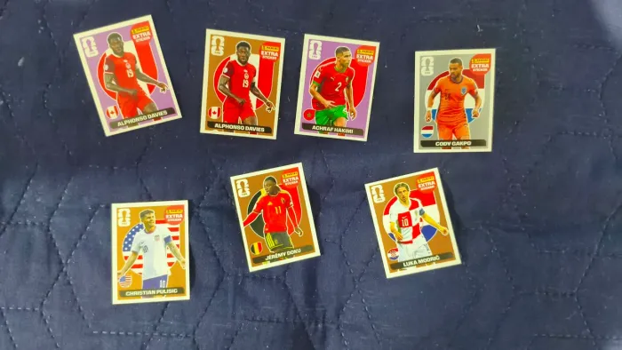 Figurinhas Legend Copa 2026, Jérémy Doku (Bronze), Luka Modric (Bronze) e etc. Descrição