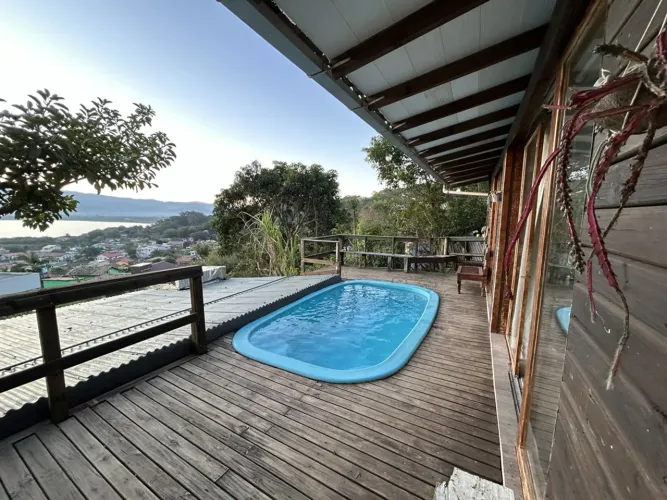 Casinha c/ piscina e vista lagoa Praia da Ferrugem