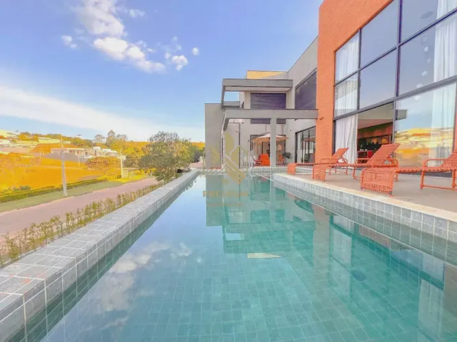 Casa de condomínio com 5 suítes, pisicna com borda infinita e uma incrível vista